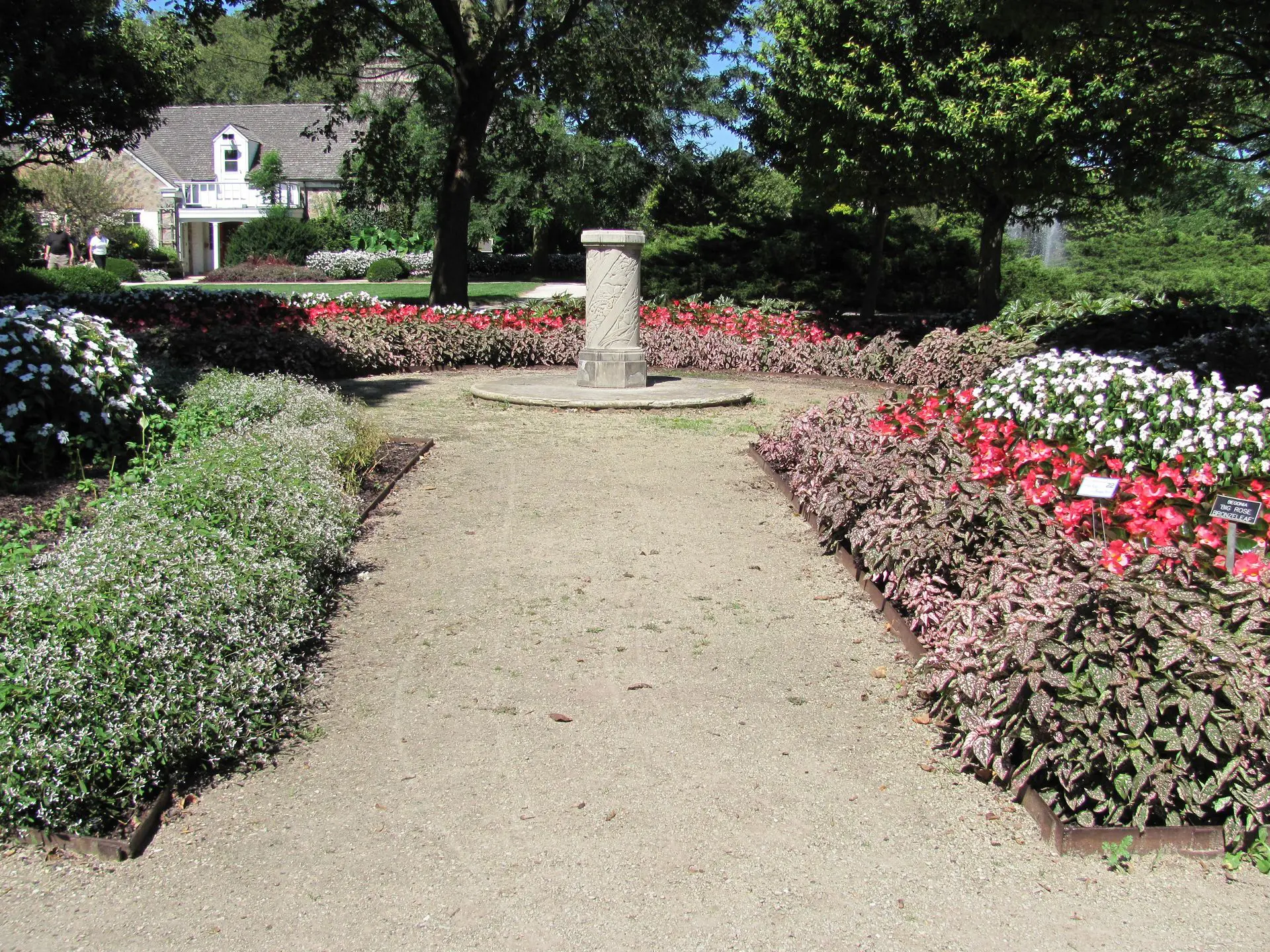 67ee9d76a70a2_ABOUT landscape partner A path in the middle of a garden
